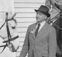 Captain Vladimir S. Littauer at a riding clinic he conducted at Sweet Briar College in February 1953. The photo was probably taken by the Public Relations office of the college. The negative of this photo was discovered in the photographic archive of Sweet Briar College in the fall of 2009 by SBC librarian Liz Kent. It was scanned by SBC assistant professor of Studio Art, Paige Critcher, in October 2009.