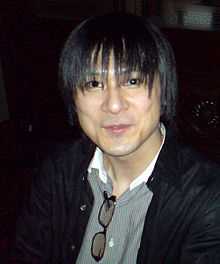 A photograph of a thin, dark-haired Japanese man.