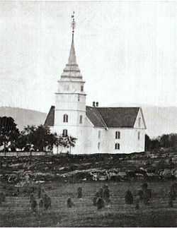 Old picture of a white church with a clocktower and spire