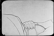 Silent animated black-and-white film of a giant mosquito drinking blood from a sleeping man.