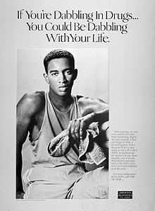  A black-and-white poster of a young black man with a towel in his left hand with the words "If you are dabbling with drugs you could be dabbling with your life" above him