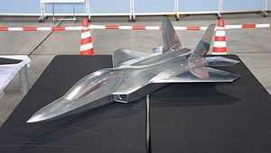 Line drawing of side view of jet fighter