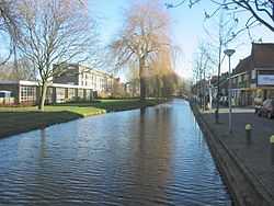 Straight canal with buildings on both sides