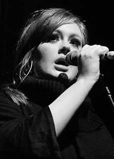 A black and white close up picture of a woman singing