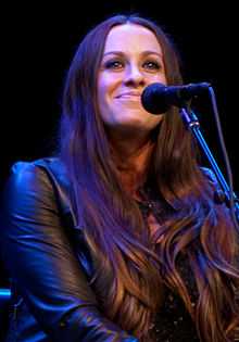 Alanis Morissette playing guitar