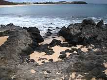 Image of black igneous rocks on the coast of Ascension Island