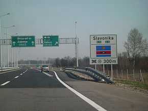 Directional traffic signs placed on a gantry and next to the A3 motorway