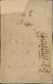 front page of the autograph of the first book, listing the title, the scoring and the abbreviated name of the composer on pale paper