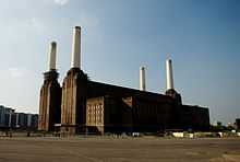 Photo of a large building with four tall chimneys.