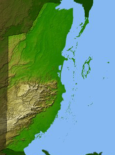 Map showing the topography of then-British Honduras, with shades of green denoting lower elevations and browner, whiter shades showing higher elevations.
