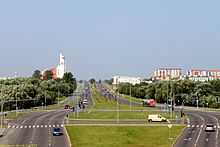 View of city street with a bicycle race