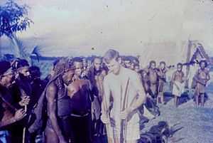 Patrol Officer (Kiap), Christopher Viner-Smith, in 1964, examines weapons carried by men of the Biami people, during a patrol to investigate the earlier theft of some steel in a Biami raid on a government patrol post.