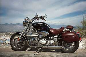  Black and burgundy BMW R1200C motorcycle with mountains in the background