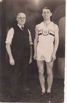 Brian Shenton in 1950 British running kit with his trainer.