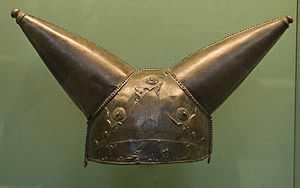 bronze helmet with two conical horns