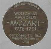  Circular plate inscribed: "London County Council: Wolfgang Amadeus Mozart 1756–1791 composed his first symphony here in 1794"