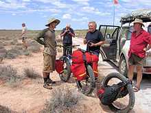 Photograph of Jakub Postrzygacz with his special Bush-Bike on the Canning Stock Route near Lake Disappointment