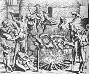 Woodcut showing 12 people holding various human body parts carousing around an open bonfire where human body parts, suspended on a sling, are cooking.