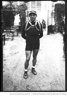 A man looking at a camera while posing.