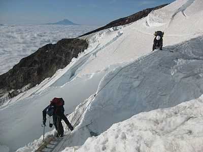 Climbers Crossing Crevasse Mt. rainier.jpg