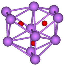  The stick and ball diagram shows three regular octahedra, which are connected to the next one by one surface and the last one shares one surface with the first. All three have one edge in common. All eleven vertices are purple spheres representing caesium, and at the center of each octahedron is a small red sphere representing oxygen.