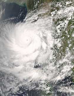 A satellite image of the Thai Peninsula. There is a mature tropical cyclone in the center of the image with a circular eye.