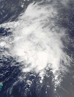 Satellite image of a disorganized mass of clouds over open waters