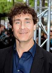 Doug Liman in front of a steel beam.