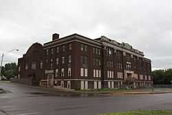 Large brick building on a shallow slope