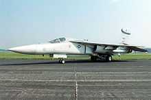  Jet aircraft with pointed nose parked on ramp.