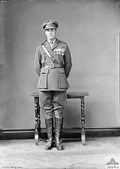 Full length portrait of man in military uniform wearing medals