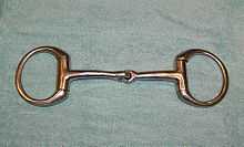 A metal horse bit with a jointed mouthpiece and a ring on either side