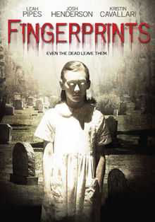 The DVD cover shows a zombie like older girl in a white short sleeve dress looking down in a graveyard, the movie title is written in blood that is leaking down