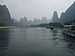 Tall karst mountains in the mist seen from the Li river