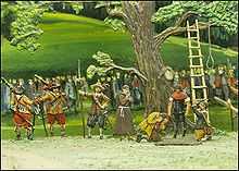 The Frankburger Würfelspiel has forced each two men to play for their life throwing the dice below the rope hanging from the tree that would be used to immediately hang the one who loses - a priest is nearby for a last prayer and a line of Bavarian soldiers guard the scene from the large mass in the background