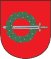 A coat of arms depicting a sword with a gold hilt and a silver blade penetrating a green wreath all on a red background