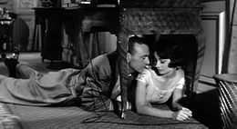 Screen capture of Gary Cooper and Audrey Hepburn lying on the floor