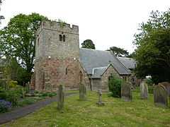 A pencil drawing of a church. From the left a square tower with battlements; a building with a peaked roof; and a smaller building also with a peaked roof. In the foreground a path between gravestones, and a person walking towards the church.