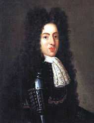 A 19 year-old man wears a black suit of armour and peri-wig.