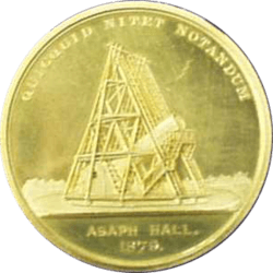 A gold medal, featuring an image of a telescope. Engraved with 'Aspah Hall 1979' and 'quicquid nitet notandum'