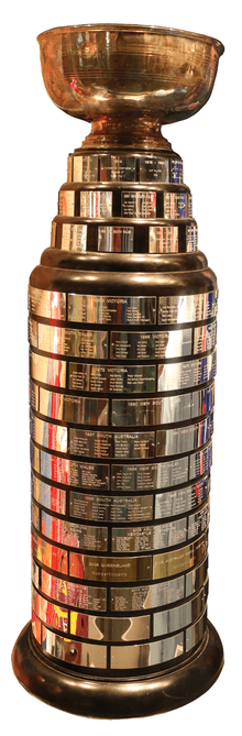 The Goodall Cup, with original cup on top, in the Hockey Hall of Fame 2014