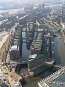 Aerial view of warehouses pervaded by loading canals and streets