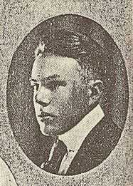 A black-and-white photograph.  Enclosed in an oval, the face of a young man in a suit and tie faces leftward.
