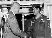 Hiroshi H. Miyamura shaking hands with President Eisenhower after being presented with the Medal of Honor