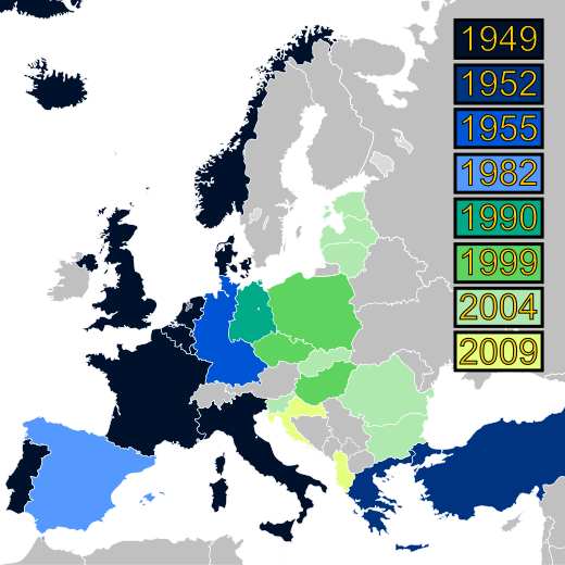A map of Europe with countries labeled in shades of blue, green, and yellow based on when they joined NATO.