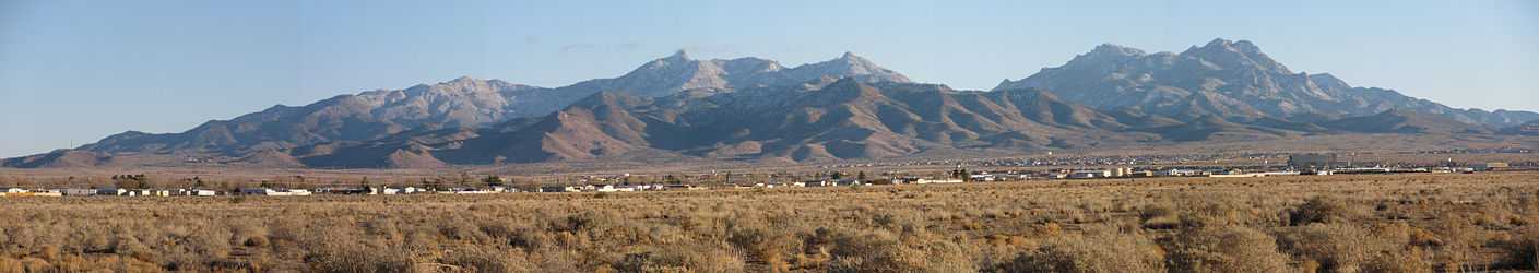 View northeast (location of west region of Peacock Mountains), east, and southeast. A panorama of the Hualapai Mountain range seen from Kingman, Arizona. The photographs were taken in late December and the mountains have a light dusting of snow. The camera location was south of Northern Avenue, east of Bank Street.