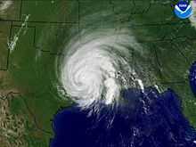 Satellite image of a tropical cyclone with a well-defined spiral organization but no eye