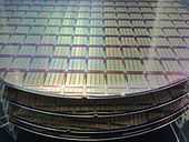 Semiconductor wafers, showing IPtronics designed ICs for parallel optical interconnects using a STMicroelectronics fabrication process