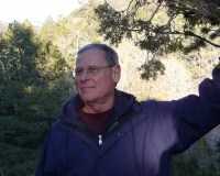 J. Baird Callicott, standing on mountainside.