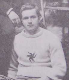 Man in hockey sweater with logo on chest